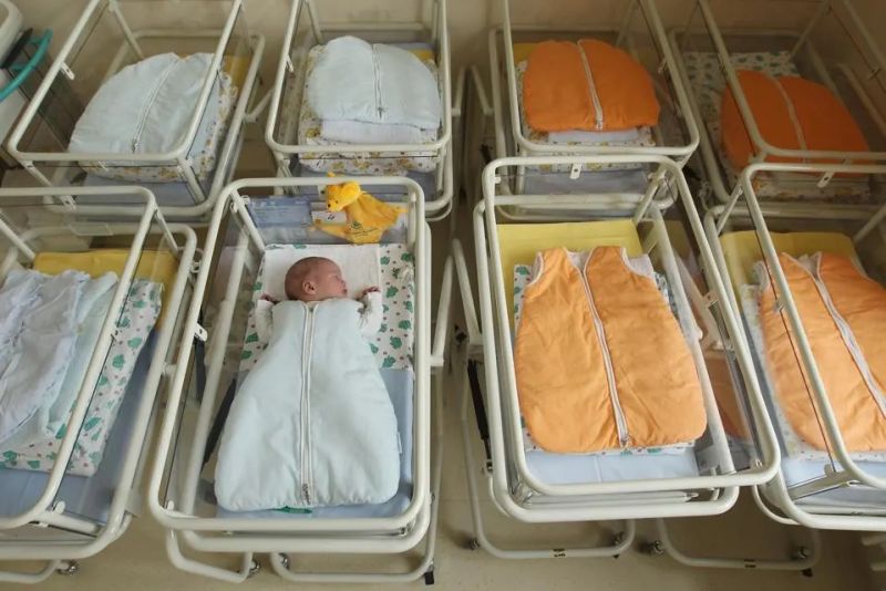 UNDISCLOSED, GERMANY - AUGUST 12: A 4-day-old newborn baby, who has been placed among empty baby ... [+]GETTY IMAGES